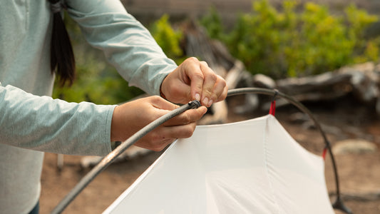 setting up tent clipping to pole