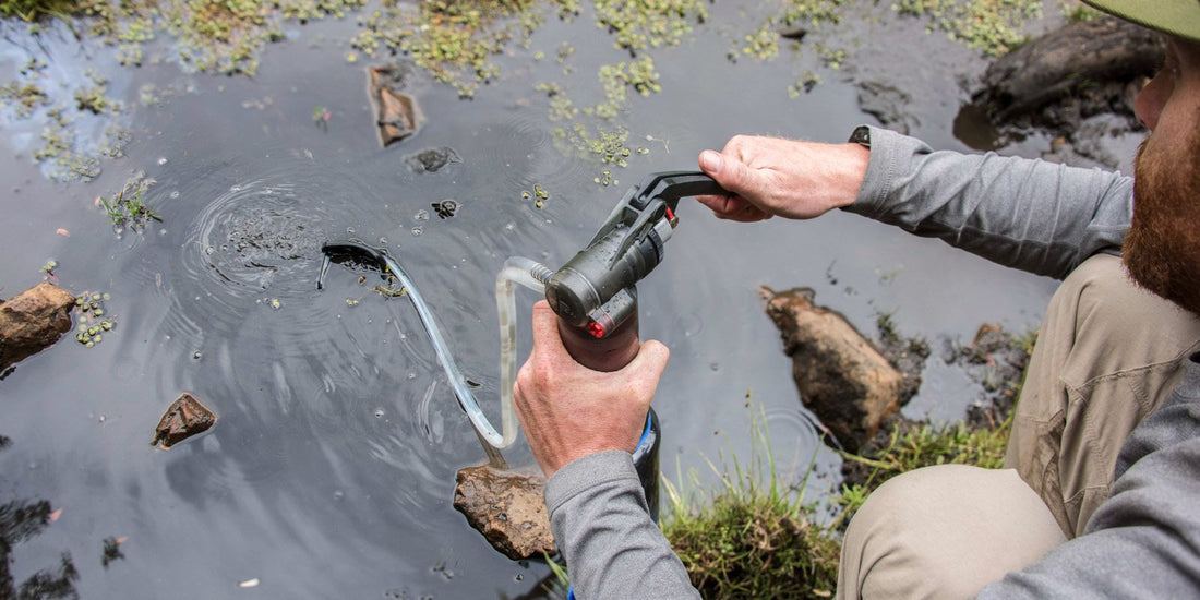 Man pumping water through MSR Guardian Filter