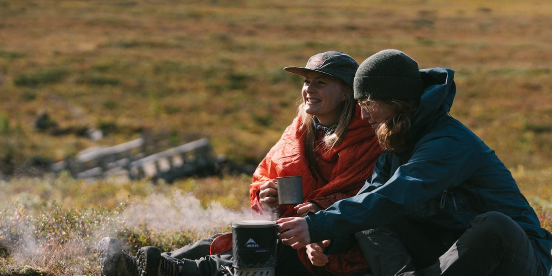 Women backpackers boiling water in MSR Windburner