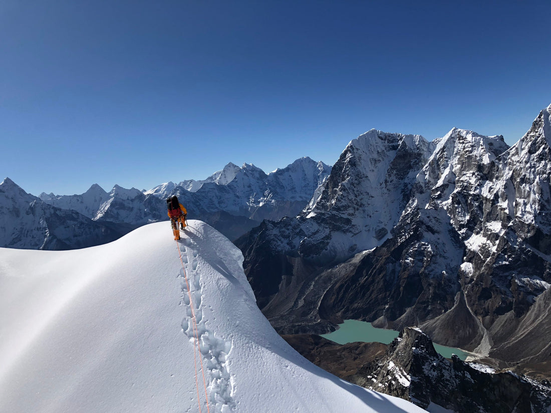 Sammy Podhurst leading along the narrow summit ridge of Lobouche.