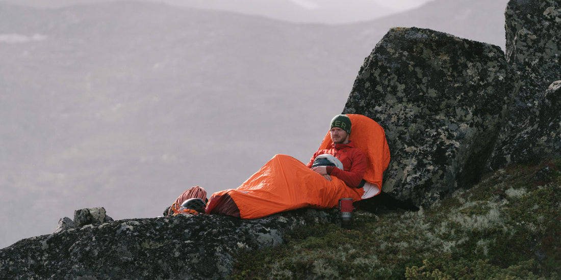 Backpacker resting in MSR ProBivy